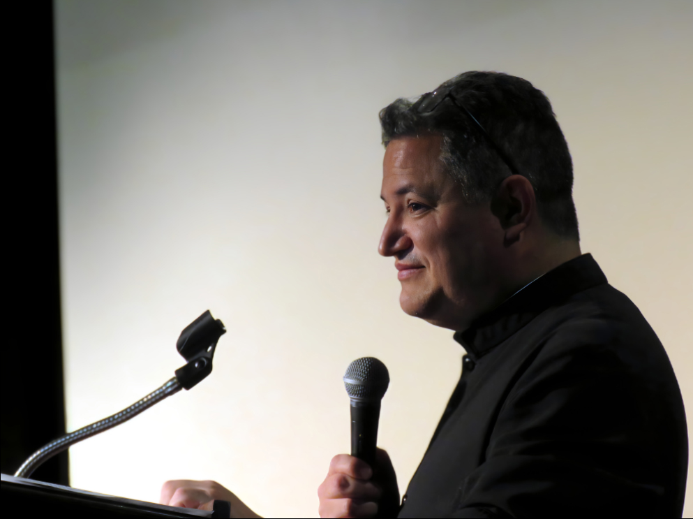 Fr. Michael Anaya keeps the schedule moving smoothly.