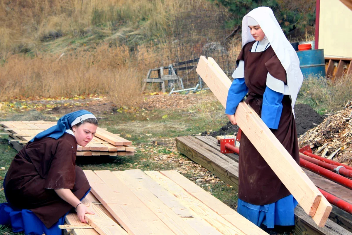 Stacking lumber for the new chapel project.
