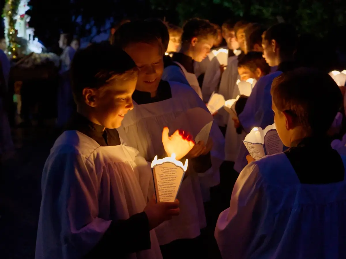 Knights of the Altar get their candles ready for the Candlelight procession.