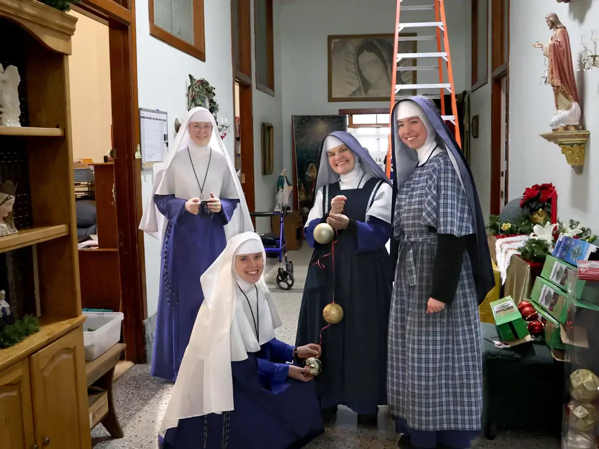 Christmas decorating is a group effort in a building the size of Mount St. Michael.