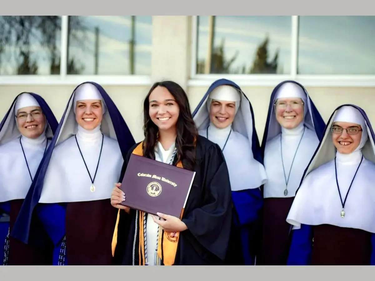 Rev. Mother and Sisters from our Wayne, Michigan, and Olathe, Colorado, missions with former student, Maddie Kraus, as she graduates from Nursing School.