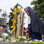 Our Sisters in Tacoma help put finishing
touches on the Marian motorcade shrine
for a drive through the city on Memorial
Day weekend. Building a shrine for a Marian motorcade