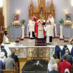During the final profession ceremony, Sr. Mary Andrea lies prostrate beneath the pall, signifying that she is now dead to the world.
