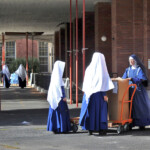 The novices help Sr. Mary Cabrini put away items from the annual Oregon-western Washington procurement drive.