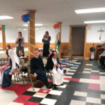 Sr. Maria Dolorosa looks on while children of St. Theresa’s Church (Oakland, Maine) play St. Cecilia’s Musical Chairs on All Saints’ Day.