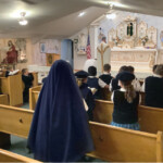 Sisters and students of Holy Guardian Angels School (Olathe, Colorado) attend the first school Mass of the year.