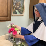 Sr. Philomena Marie arranges flowers for an upcoming feast. Sisters on mission often help with sacristy work and preparing the altar for Holy Mass.