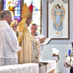 Silver jubilarian Sr. Marie Janae solemnly renews her vows. Every jubilarian is presented with a wooden cross, a token of the years of her fidelity.