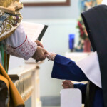 After having made profession of perpetual vows, Sr. Philomena Marie receives a gold band, a symbol of her eternal union with Christ Crucified.