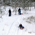 During the Christmas break, the Novitiate Sisters enjoy the freshly fallen snow sledding down the hill.