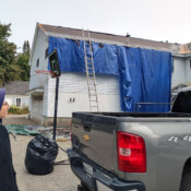 Sr. Mary Teresita looks at the progress made on replacing the roof of the convent in Oakland, Maine. New roof for St. Theresa's Convent in Oakland, Maine