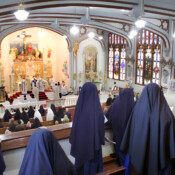 Sisters and students sing during the pontifical high Mass during the Fatima Conference at Mount St. Michael.