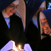 Spread the light! Two Sisters prepare for the candlelight procession in honor of Our Lady during the Fatima Conference.