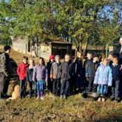Sr. Mary Genevieve and the 1st, 2nd and 3rd graders visit the cow and the new calf on the seminary farm. Brother Simon and Felix, the seminary dog, came along.
