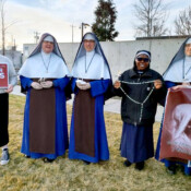 The Sisters and students pray the Rosary outside Planned Parenthood.