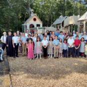 Parishioners and catechism campers gather by the new playground at St. Theresa’s in Oakland, Maine.