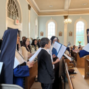 The parish choir at Our Lady of Mount Carmel (New Hampshire) was augmented by a guest chorale for the High Mass on the titular parish feast.