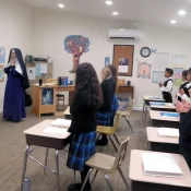 Prayers before classes are a normal part of every CMRI school — more fervent, of course, on test days. (Sr. Madeleine Marie and her class at Mary Immaculate Queen Academy, Rathdrum, Idaho.)