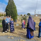 Sr. Mary Evangeline and students from Holy Guardian Angels School visit a local cemetery.