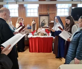 Sr. Mary Bernadette leads the parish Christmas Carol sing-along at Our Lady of Mount Carmel Church in New Hampshire.