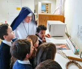 Sr. Mary Imelda talks about the sufferings of Jesus with the primary students.