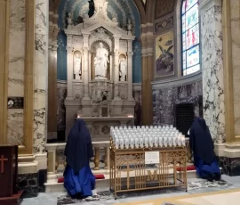 Sr. Bernardine Marie and Sr. Maria Magdalena visit the shrine of St. Joseph at Our Lady of Victories Basilica in New York.