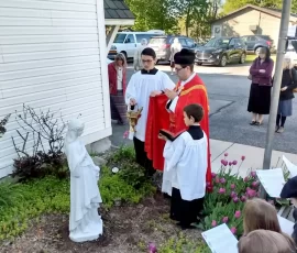 Fr. Joseph Appelhanz blesses the new statue of St. Philomena, patroness of the school at Holy Rosary Church in Middleville, Michigan.