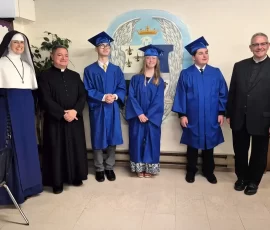 Principal, pastor and prelate with the eighth-grade graduates at St. Mary’s Academy in Tacoma.